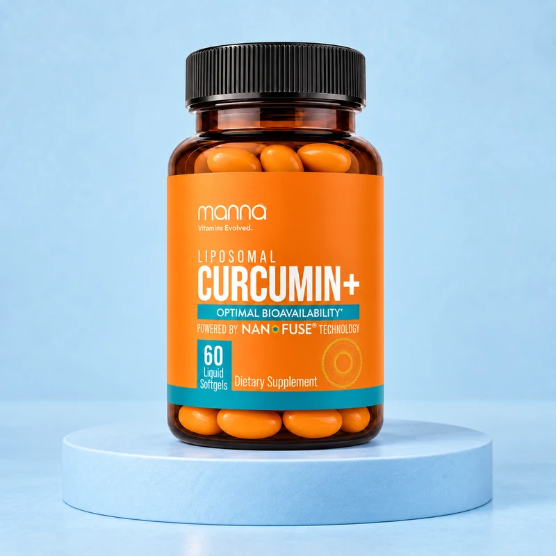 Manna Curcumin+ bottle with orange softgels on a pale blue studio platform